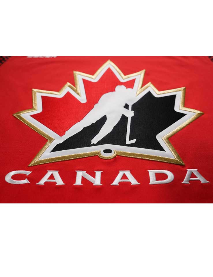 Close-up of the gold-bordered Hockey Canada crest