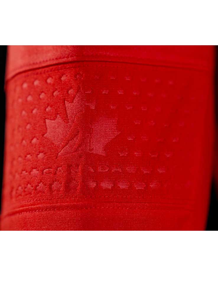 Close-up of the debossed, tone-on-tone Maple Leaf and Hockey Canada logo on the elbow