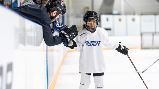 First Shift player giving a high five