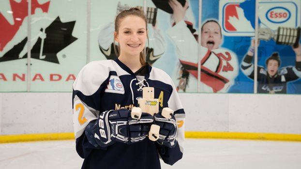 Northern Selects forward Megan Smith holding an Olliebot