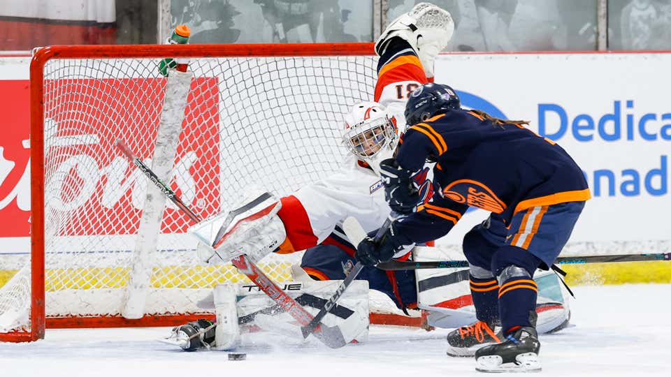 Edmonton Jr. Oilers attempt to score on the Lloydminster Steelers.