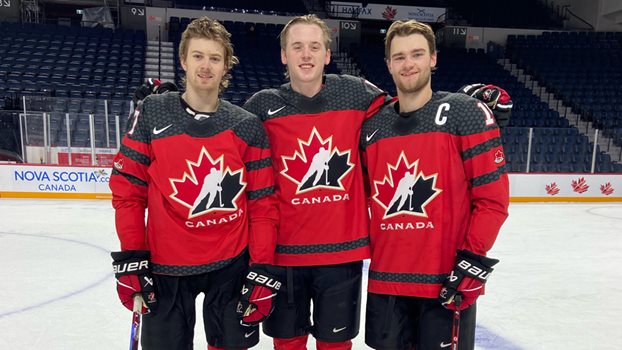 Brennan Othmann (left), Brandt Clarke and Shane Wright pose on photo day at the 2023 World Juniors in Halifax.