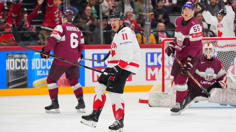 Travis Konecny celebrates after scoring against Latvia.