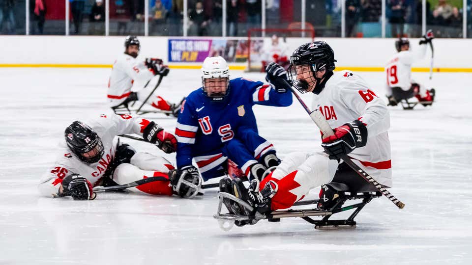 Rob Armstrong controls the puck in Game 1 of a para hockey series between Canada and United States.