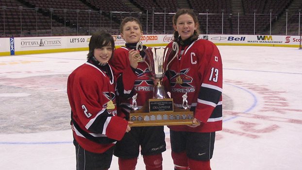 Sean Walker, Chris Tierney and Erin Ambrose pose with a trophy.