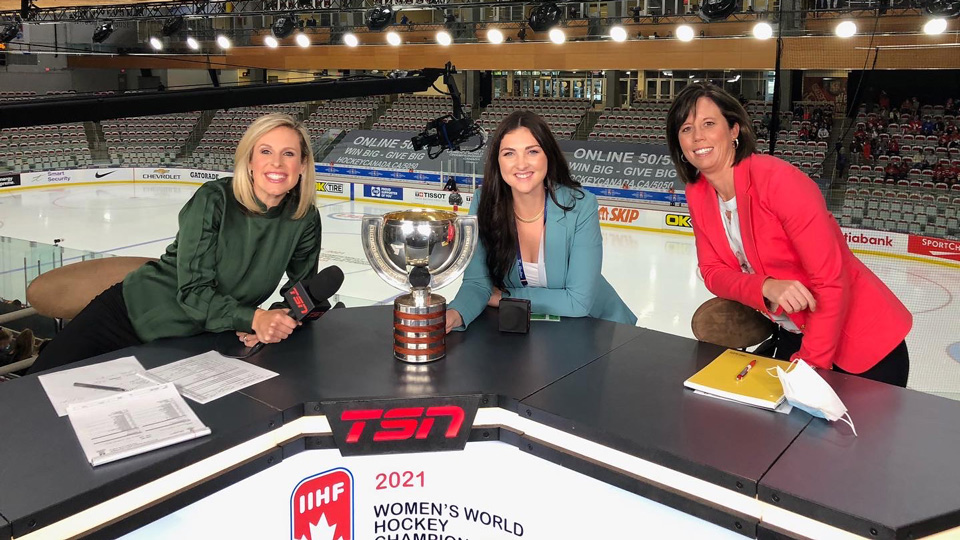 Kenzie sitting at the TSN desk with Tessa Bonhomme and Carla MacLeod