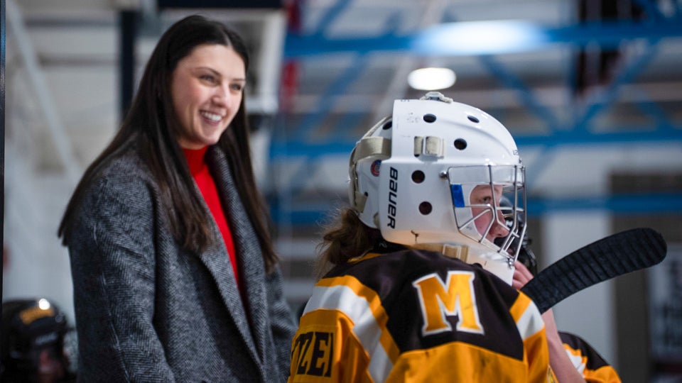 Lyndsey Janes coaching on the bench.