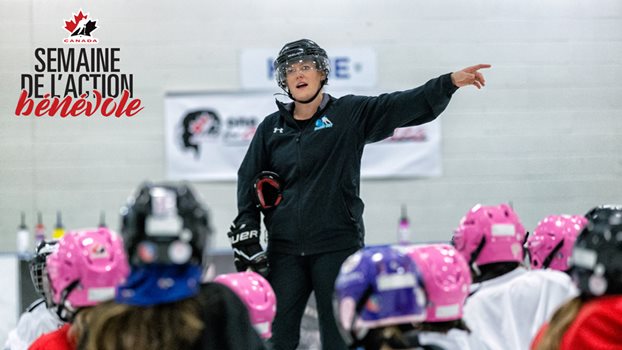 Kaylee Grant instructs a group of young girls on the ice at the One For All event in Yellowknife.